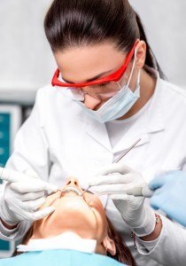 Dental patient having periodontal therapy to correct bad breath and gum recession