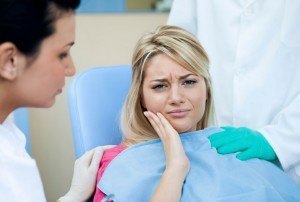 Patient needing pain relief for pain and discomfort caused by wisdom teeth